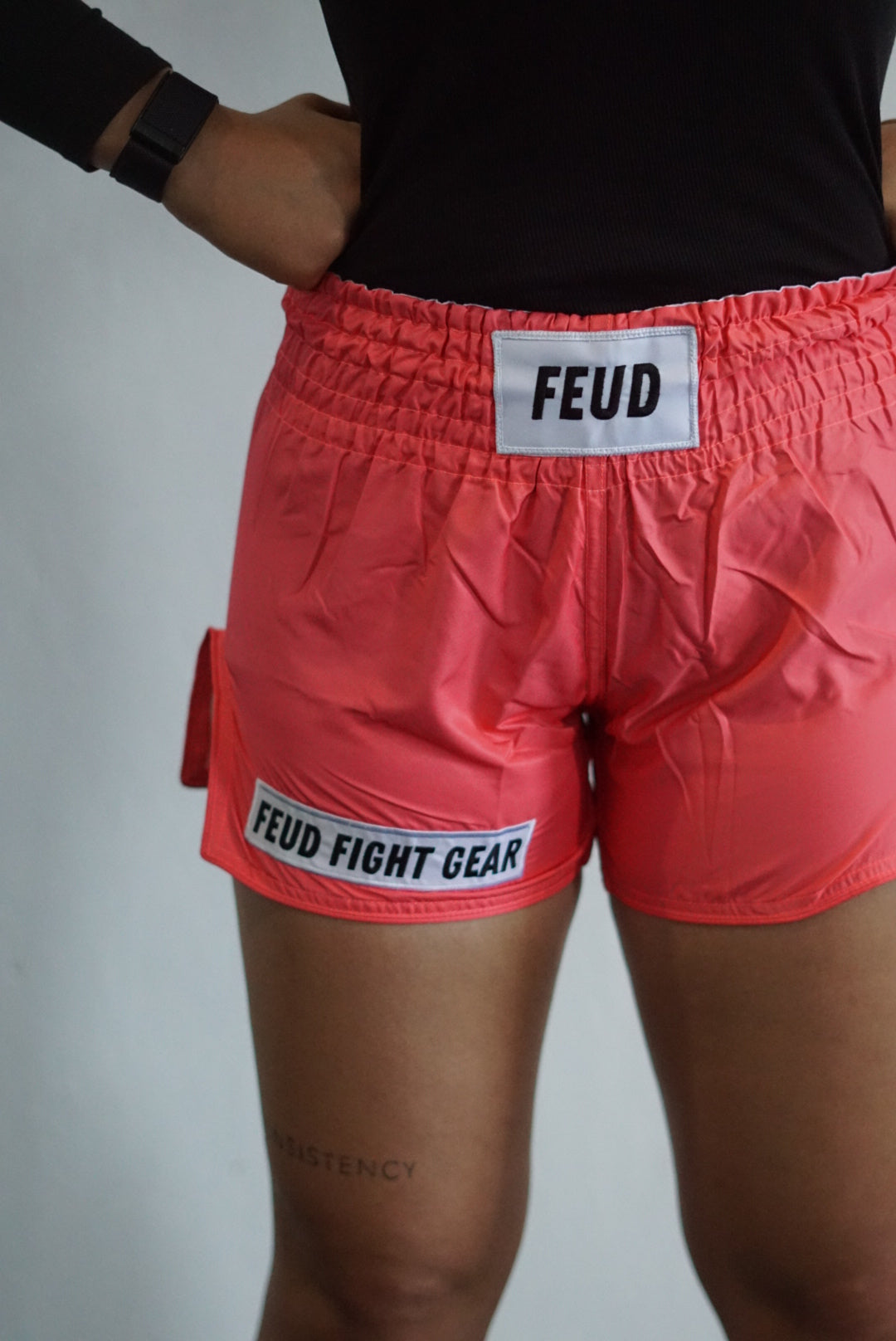 Muay Thai shorts for men and women. Coral pink in colour. Custom thai shorts are available for personalised with your name.