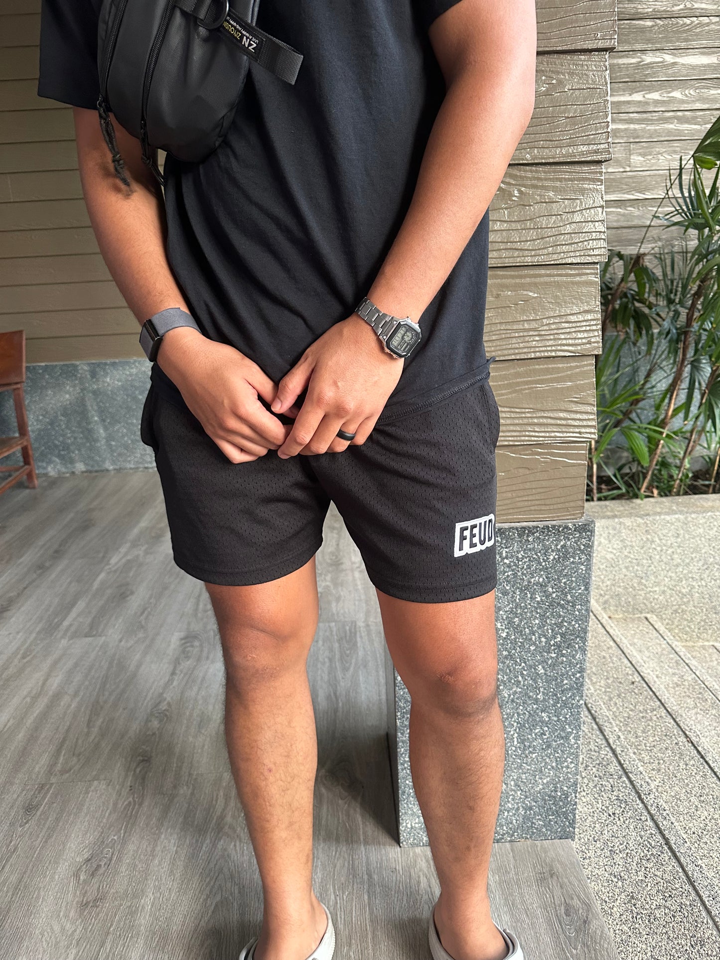 Man styling Feud mesh shorts casually