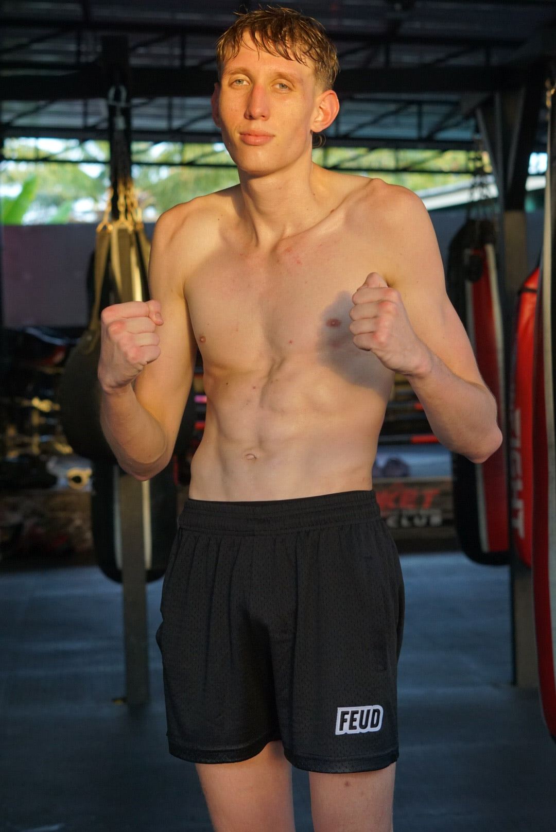 Male fighter wearing Feud mesh shorts