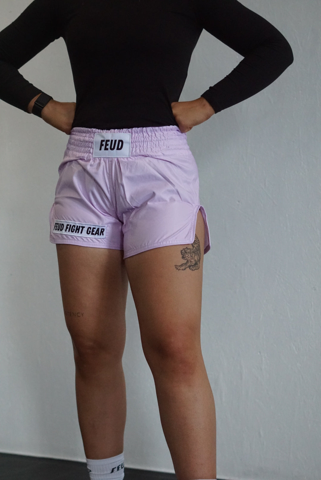 Woman wearing lilac Muay Thai shorts
