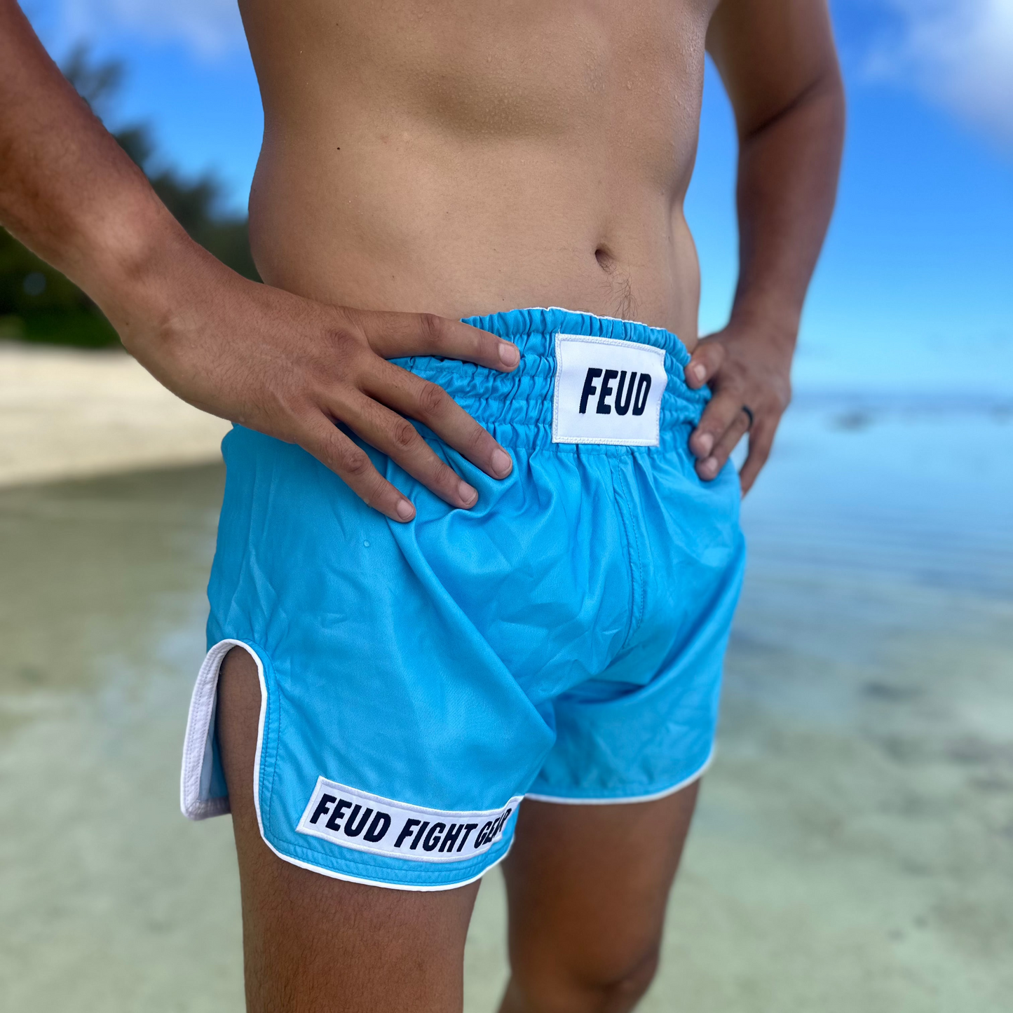 Ocean blue Thai shorts, beach angle.
