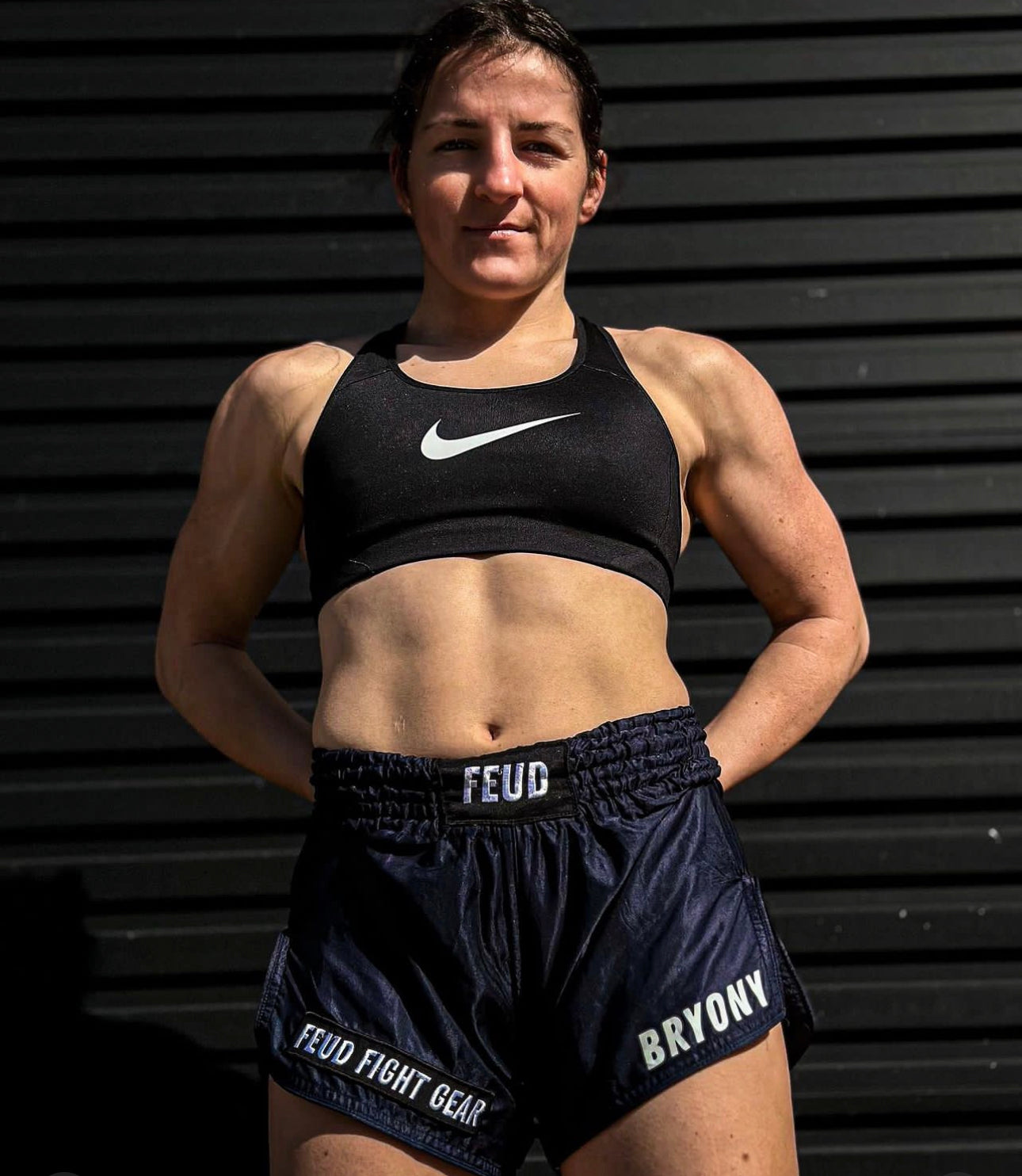 Woman wearing Navy Blue Thai Shorts by Feud Fight Gear