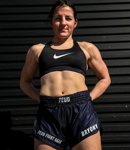 Woman wearing Navy Blue Thai Shorts by Feud Fight Gear