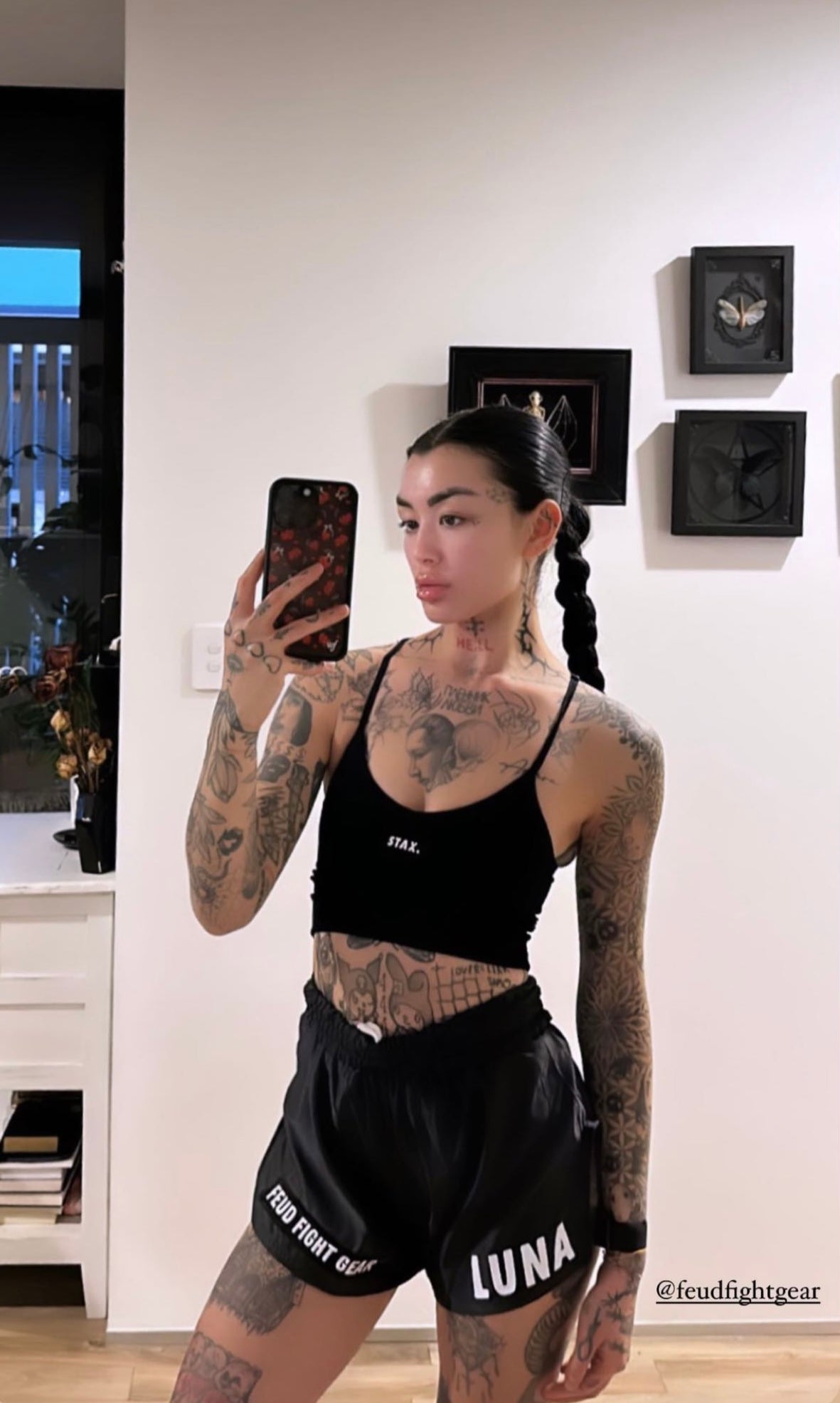 Tattooed woman in Gunmetal Grey Thai Shorts selfie