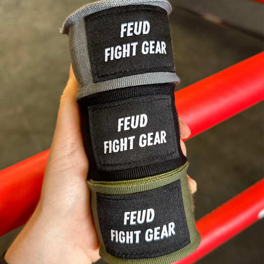 Muay Thai boxing hand wraps in khaki green, grey and black.