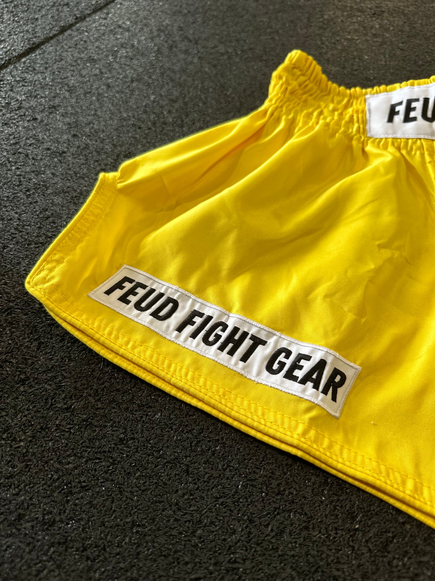 Retro-style yellow Thai boxing shorts