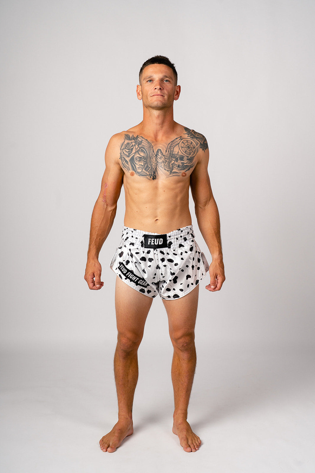 Male model wearing Dalmatian print Muay Thai shorts