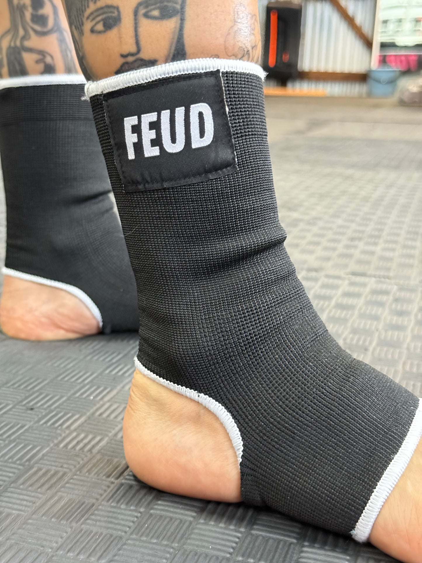 Muay Thai ankle guards with feud logo 