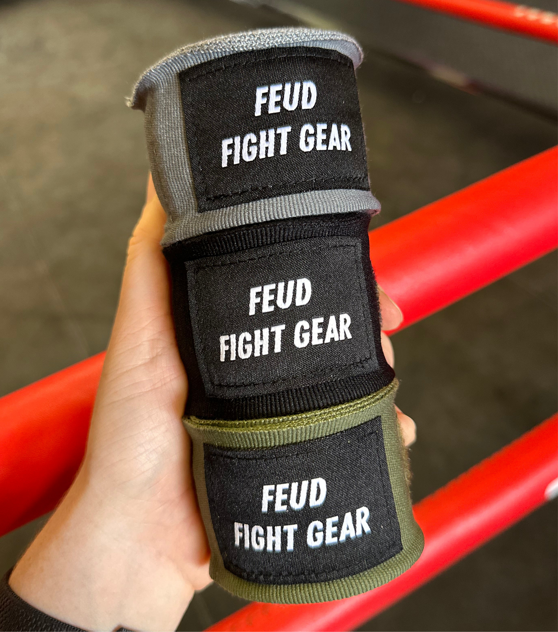 Muay Thai boxing hand wraps in khaki green, grey and black. 