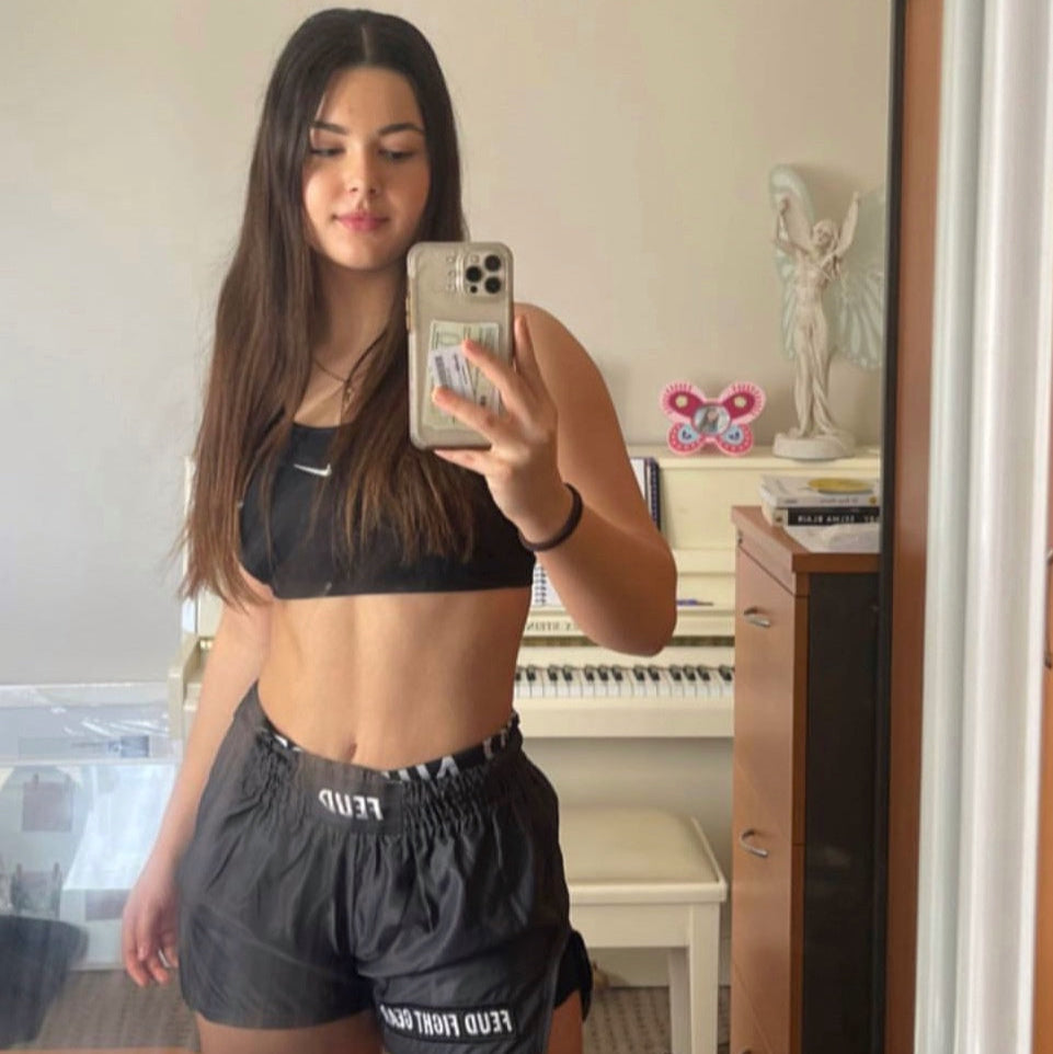 Woman wearing Gunmetal Grey Thai Shorts by Feud Fight Gear